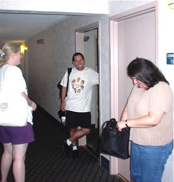 Heather M., Mark, and Cynthia chatting in hallway